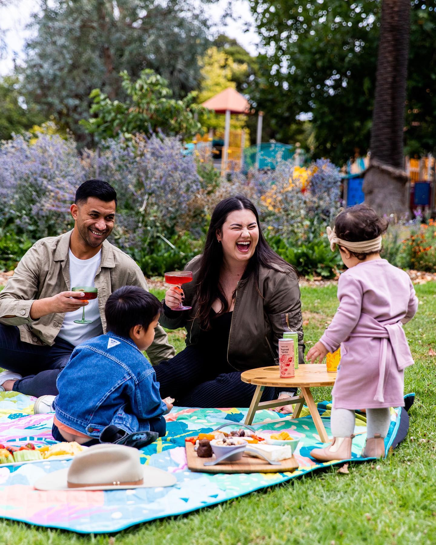 family having a picnic at the park on the jumbo picnic blanket