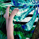 sitting on a play mat in the park