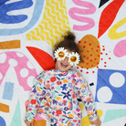 girl smiling on her picnic blanket